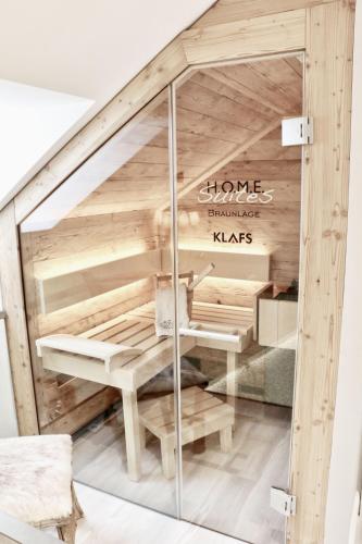 a room with a wooden bunk bed under the stairs at HOME Suites Maisonette mit Sauna in Braunlage