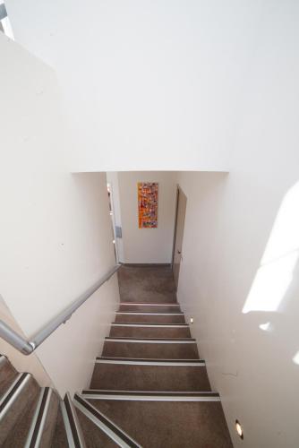 a stairway in a building with a stair case at Hotel La Beauze in Aubusson