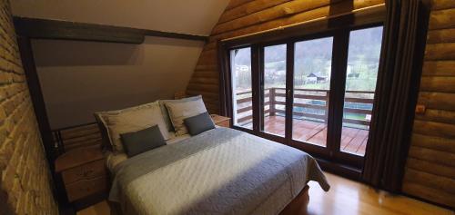 Ένα ή περισσότερα κρεβάτια σε δωμάτιο στο Villa Vrelo Bosne