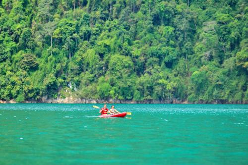 a group of people in a kayak in the water at Khao Sok River Lodge Hotel in Khao Sok