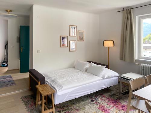 Un pat sau paturi într-o cameră la Appartements Steiner - SKI IN - SKI OUT