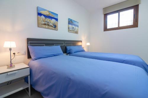 Posteľ alebo postele v izbe v ubytovaní Santa María FreshApartments