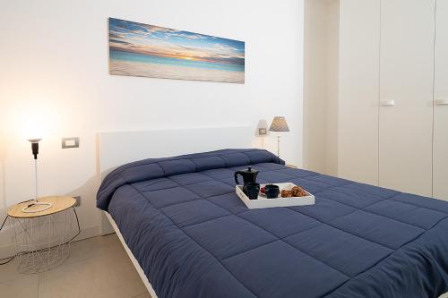 Posteľ alebo postele v izbe v ubytovaní APARTMENT BREZZA DI LAGO - Regarda Travel