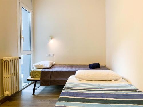 Säng eller sängar i ett rum på Apartamento Perfección al lado de Caldea