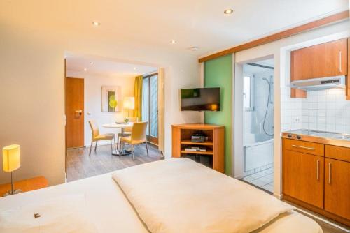 Postel nebo postele na pokoji v ubytování Hotel Am Nockherberg