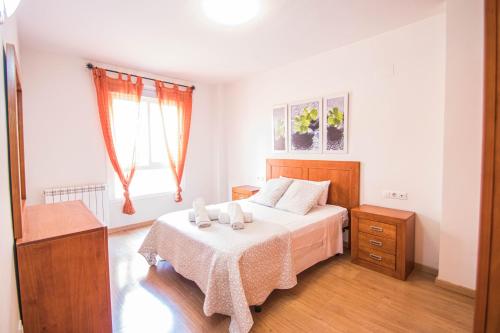 Posteľ alebo postele v izbe v ubytovaní Serrallo Apartment