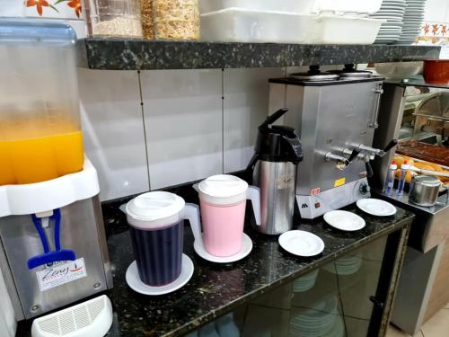 A cozinha ou cozinha compacta de Pousada Aconchego