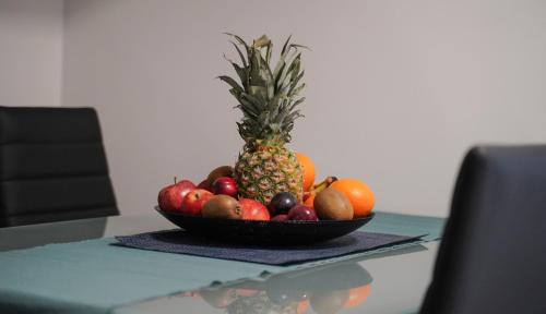 a bowl of fruit sitting on a table at Ferienhaus in Niederösterreich mit 3 Apartments mitten im Wald in Feichtenbach