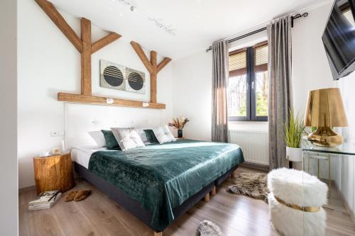 Posteľ alebo postele v izbe v ubytovaní Apartament Onyks