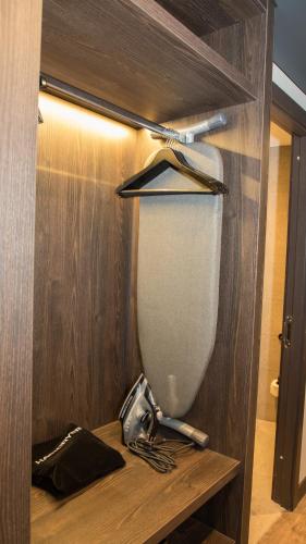 a baseball dugout with a baseball bat and a baseball bat at Radisson RED London Greenwich The O2 in London