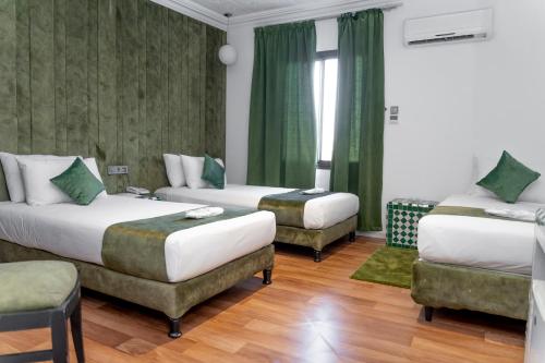 Postel nebo postele na pokoji v ubytování Hotel Majestic