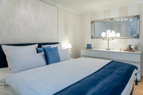 Postel nebo postele na pokoji v ubytování Ferienwohnung Luxus mit Wattenmeerblick