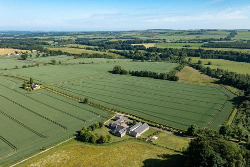 an aerial view of a farm with fields and trees at Home Farm B&B - Sunflower Room in Forfar