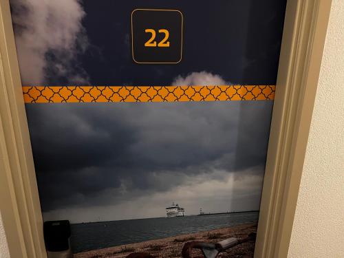 a door with a view of the ocean at Hotel Nap in West-Terschelling