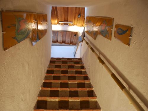 a stairway with a checkerboard patterned stair case at WALD-LAND-HOF Schloss Rosenau in Schloss Rosenau