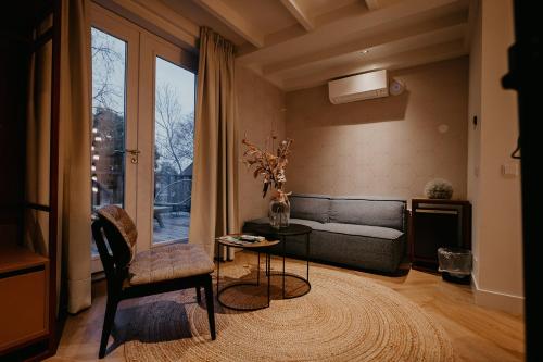 a living room with a couch and a table at Villa Noordzee in Renesse