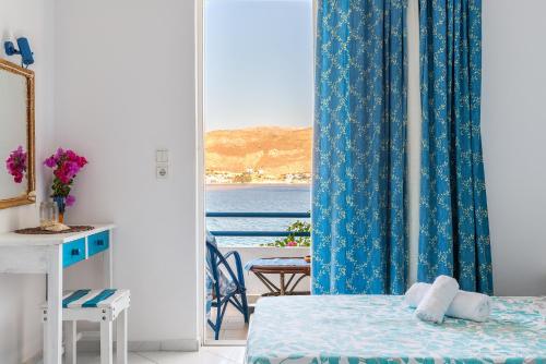 Postel nebo postele na pokoji v ubytování Antoniadi Rooms