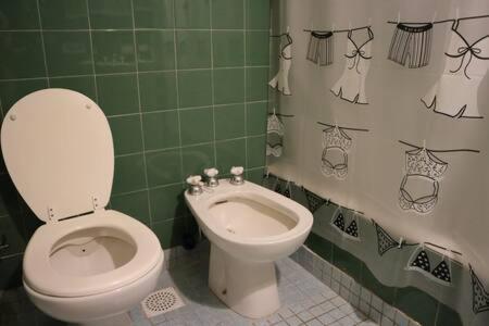 a bathroom with a toilet and a bidet at Habitación en Las Cañitas Palermo el mejor lugar de Bs As in Buenos Aires