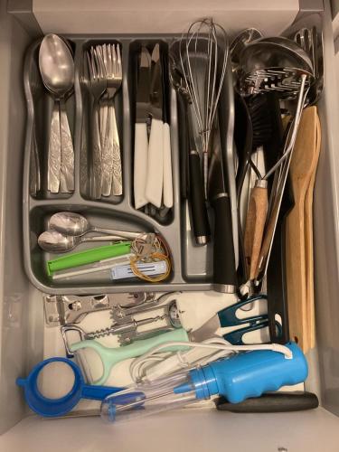 a drawer full of utensils in a refrigerator at Ivkovic spa Milmari N16 in Kopaonik