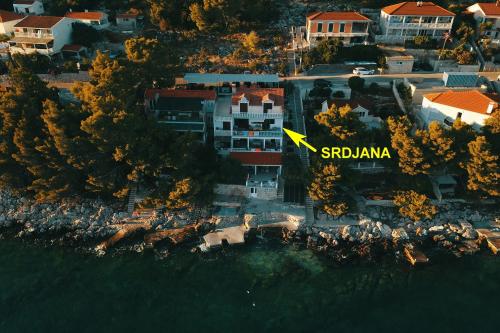 an aerial view of a house with a synula sign on it at Apartmani Srdjana in Prizba