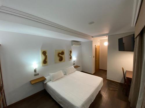 Кровать или кровати в номере Hotel Rural Finca Aldeola