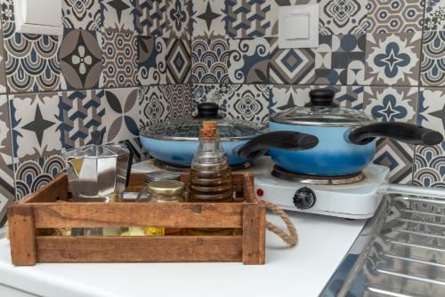 a kitchen counter with a tea kettle and a toaster at Antoniadi Rooms in Livadia
