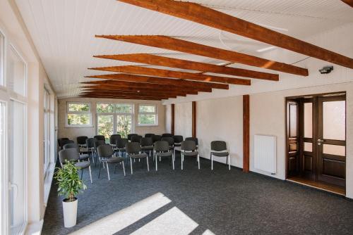 a room with a table and chairs in it at ОРАНТА in Truskavets