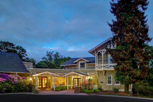 a large house with lights on in a driveway at Tarrytown House Estate in Tarrytown