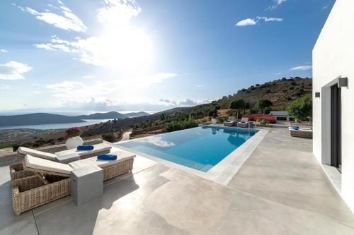 a villa with a swimming pool with a view at Elounda Villa Kalydon in Elounda