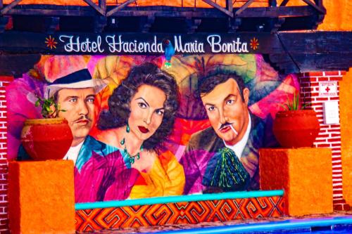 a mural on the side of a building at Hacienda Maria Bonita Hotel in Playa del Carmen