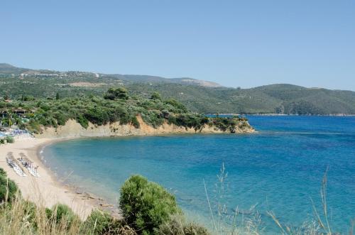 a beach in the middle of the ocean at Thea Studios in Finikounta