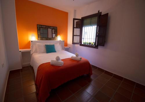 a bedroom with a bed with two towels on it at Mirador Alhambra - 2 Private Terraces - Wifi - in Granada