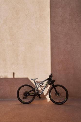 a bike parked in front of a wall at Praia do Canal Nature Retreat - Small Luxury Hotels of the World in Aljezur