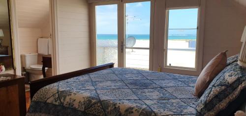 a bedroom with a bed and a window at Apollo Bay Guest House in Apollo Bay