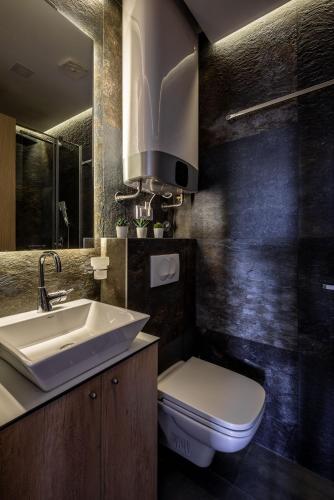 a bathroom with a white sink and a toilet at Belly in Vračar (historical)