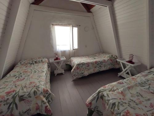 En eller flere senge i et værelse på La Escondida