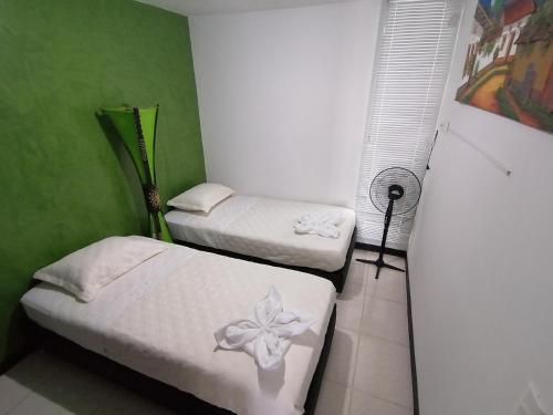 Ένα ή περισσότερα κρεβάτια σε δωμάτιο στο Apartamento Parque del Café