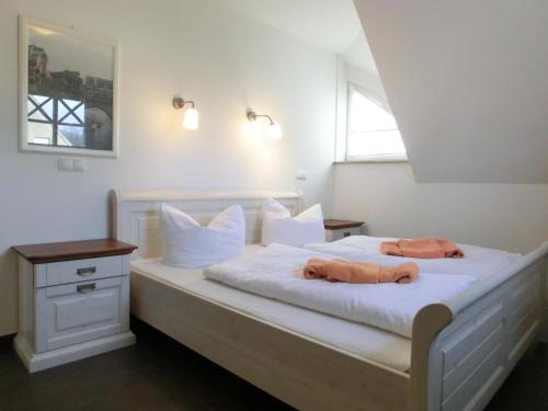 Ένα ή περισσότερα κρεβάτια σε δωμάτιο στο Ferienhaus FH17