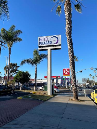 a sign for a hotel indianota on a street at Hotel Milagro in Chula Vista
