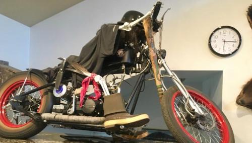 a motorcycle on display in a room with a clock at Shangri-La - Near Mendenhall Glacier and Auke Bay -DISCOUNTS ON TOURS! in Mendenhaven