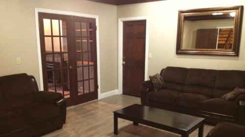 a living room with a couch and a coffee table at Glacier Guest Room - PRIVATE ROOM IN SHARED HOUSE REDUCED PRICE ON TOURS in Juneau