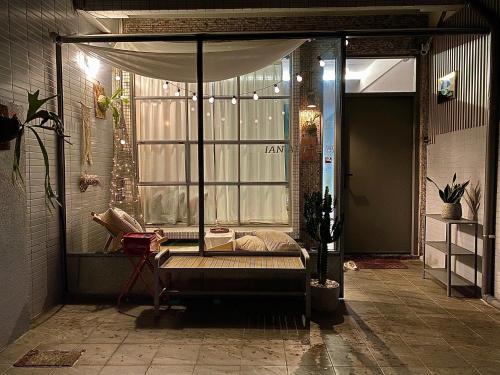 a room with a window with a bed in it at 安平言寓包棟旅宿 Ian Apt in Tainan