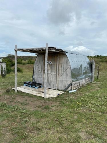 a large tent in the middle of a field at biohotel tatacoa Qji in Villavieja