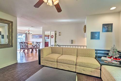 a living room with a couch and a dining room at Vegas Oasis Home with Pool and Spa 7 Miles to Strip in Las Vegas