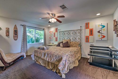a bedroom with a bed and a ceiling fan at Vegas Oasis Home with Pool and Spa 7 Miles to Strip in Las Vegas