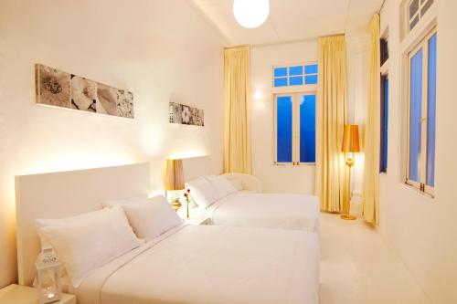 Cama o camas de una habitación en Chulia Heritage Hotel
