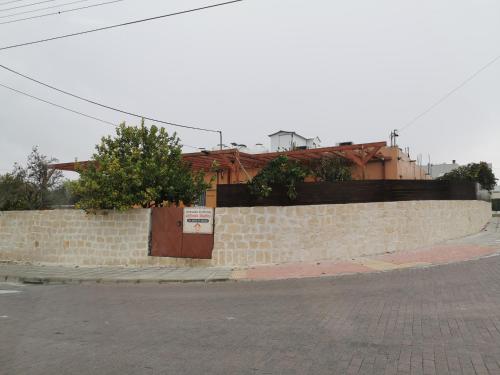 a brick wall with a door on the side of a street at Nicosia rooms Studios in Nicosia