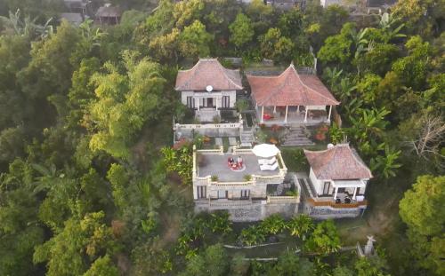 an aerial view of a house in the forest at Ayodya Batur Villa in Kintamani