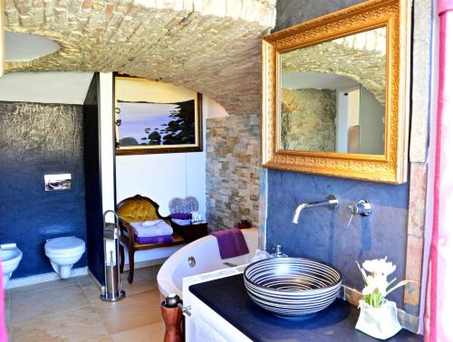 a bathroom with a sink and a mirror at B&B Torre Porta Marina in Ventimiglia