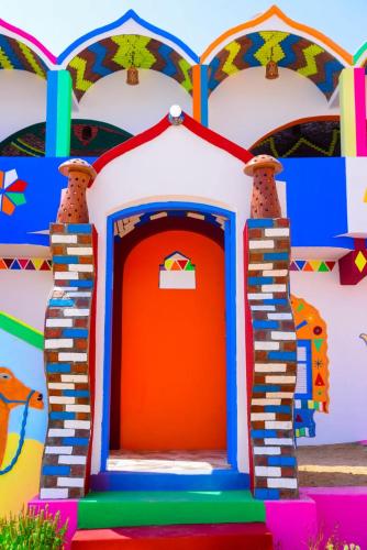 a colorful play house with a red door at malindy KA ماليندى كا in Aswan